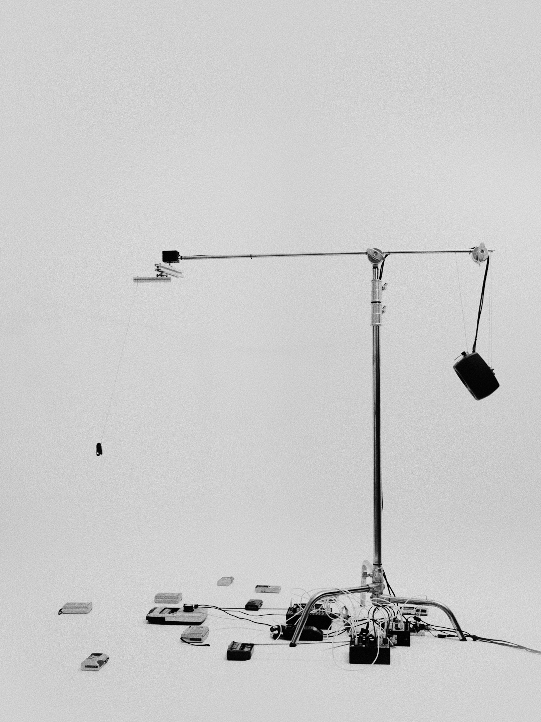 Phantom V3 installation: a tall rotation mechanism with microphones suspended above cassette players.